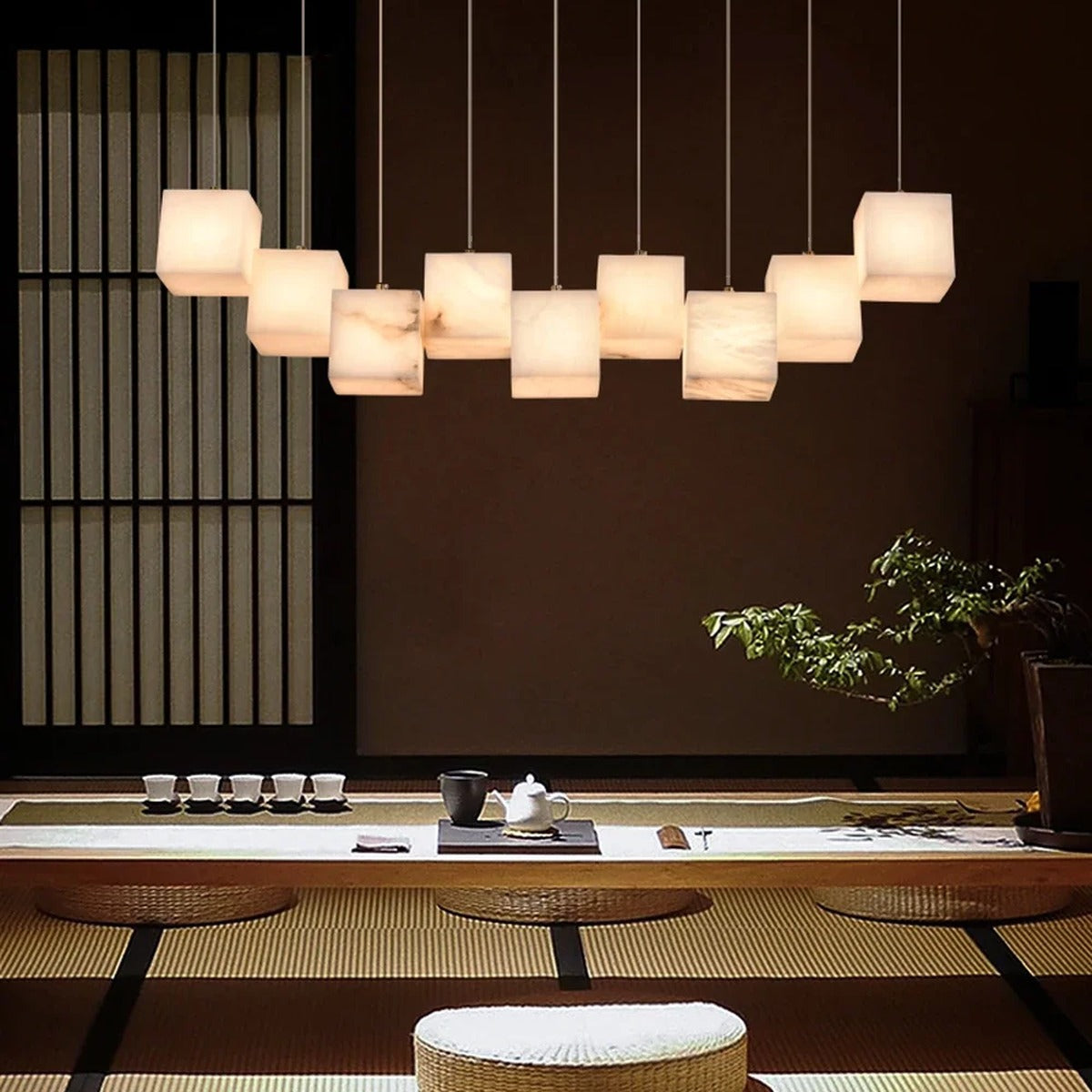 Rectalux alabaster stone cube pendant lights over Japanese-style dining table