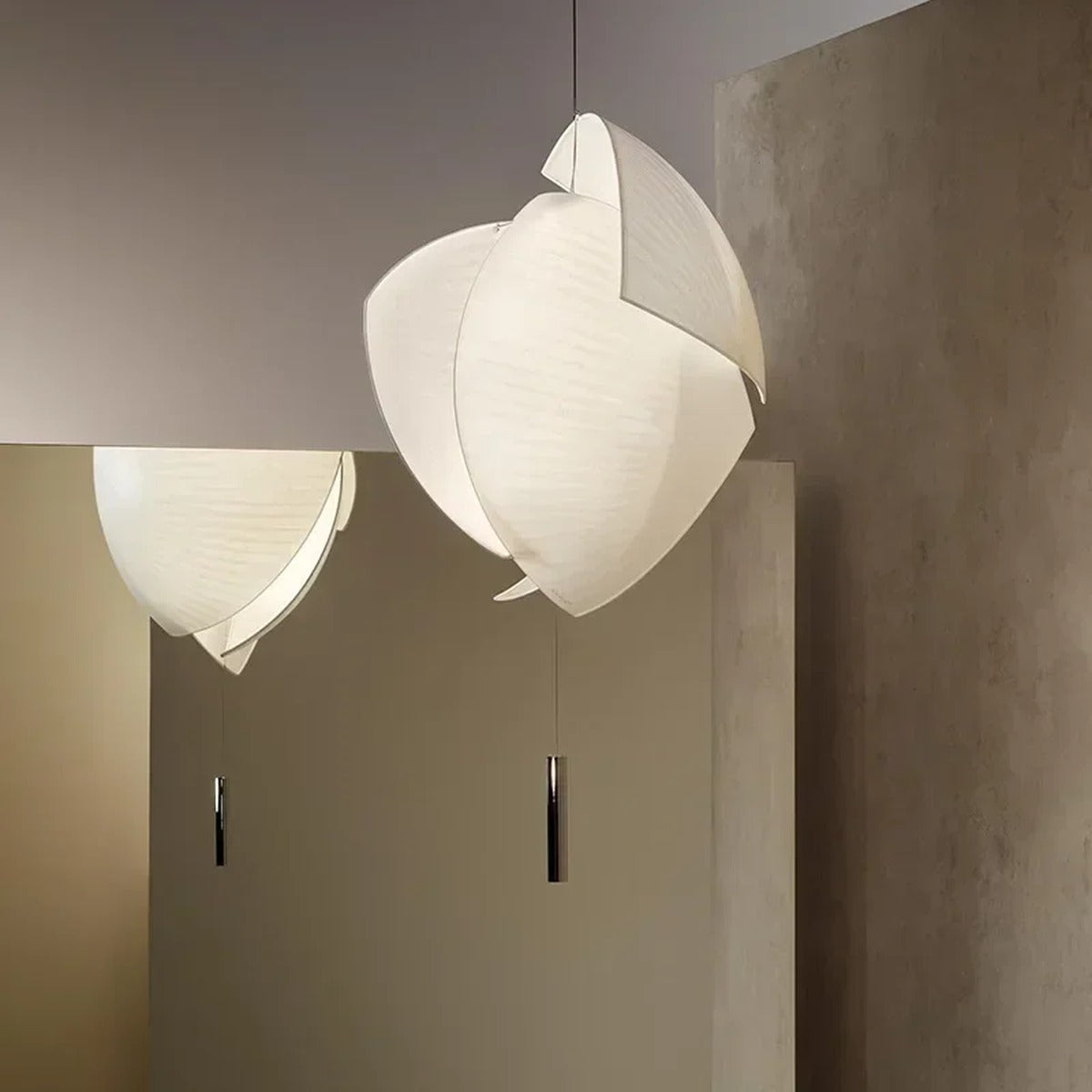 Corolla sculptural fabric pendant light — lifestyle view, lit