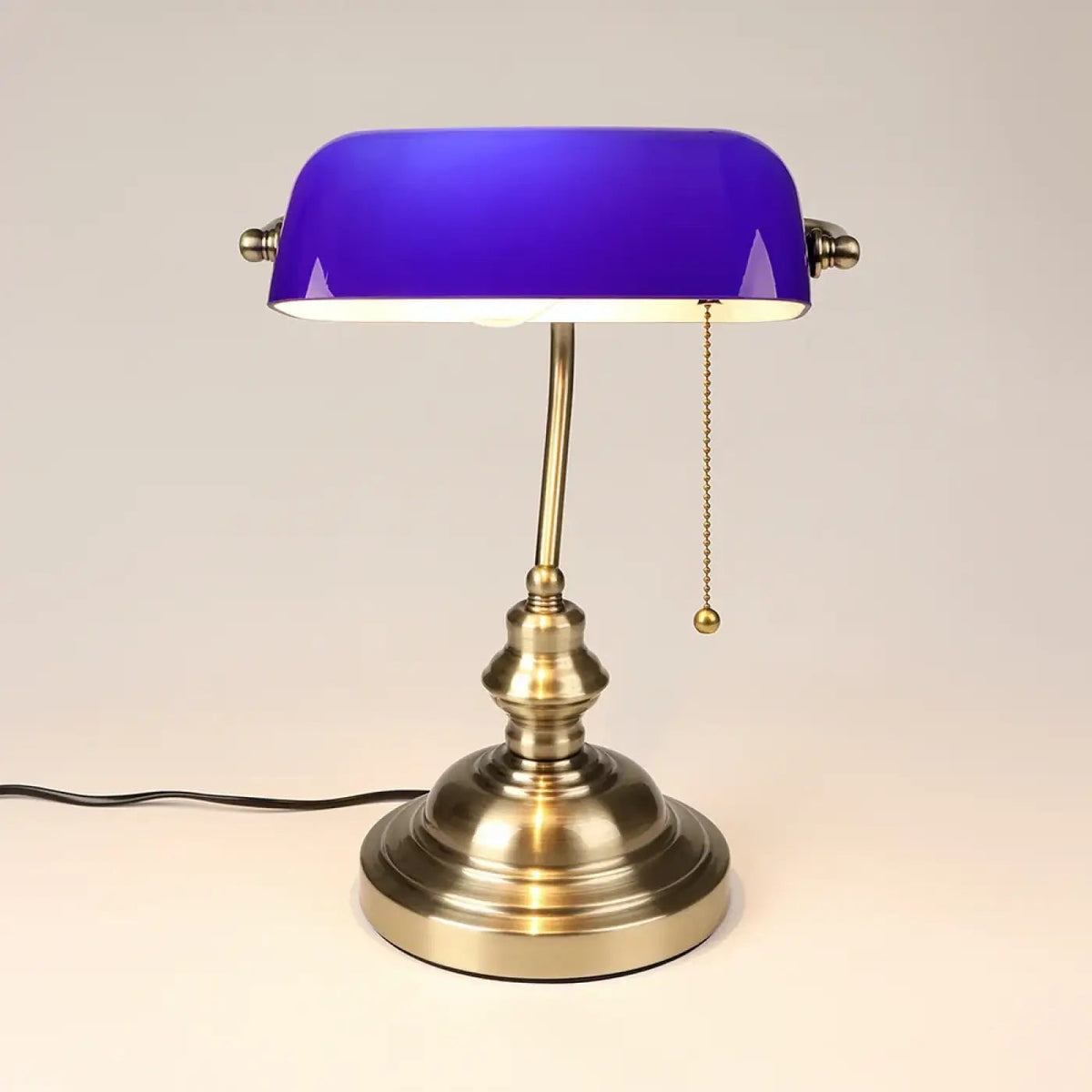 Banvex banker's lamp on mid-century reading table with leather journal