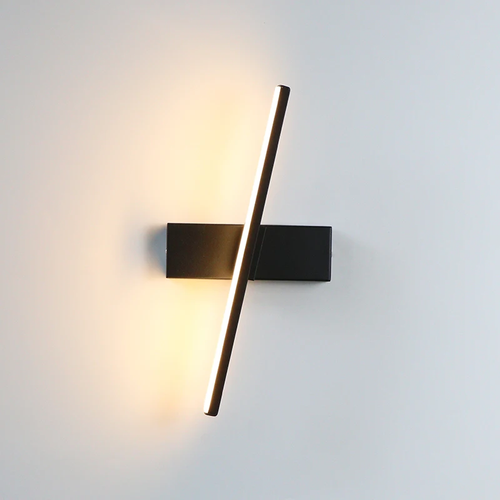 Binova wall sconce in Matte Black, rotating light bar at an angle, studio view