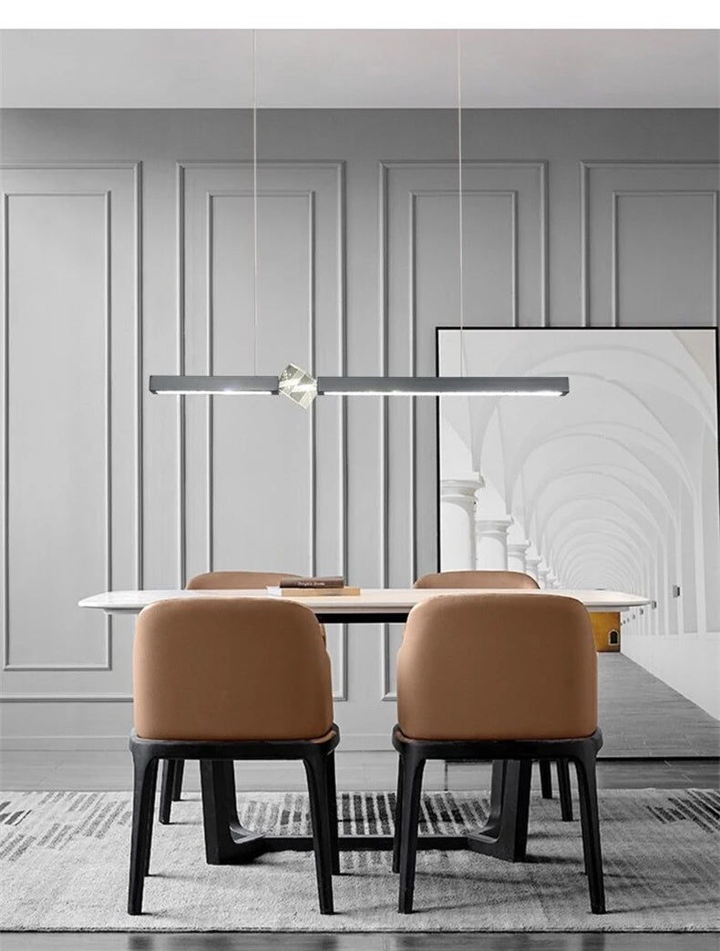 Prevoria linear LED pendant in matte black above a dining table