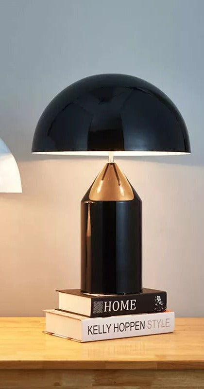 Bolentrix Gloss Black mushroom table lamp on stacked books