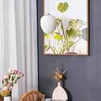 Byaelon alabaster pebble pendant light - single pendant near artwork