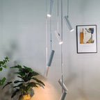 Solerno adjustable multi-head spot pendant — staircase installation, warm light