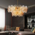 Iralux round drum chandelier above a living room sofa