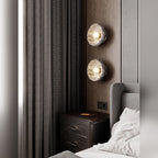 Uvrix natural jade stone wall sconce in amber onyx finish, bedside lifestyle