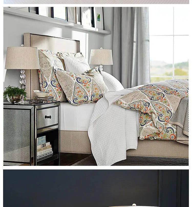Calyra crystal ball table lamp on mirrored nightstand beside upholstered bed