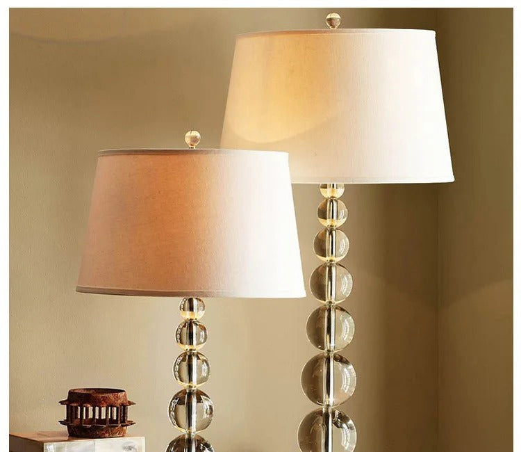 Calyra stacked crystal ball table lamps, 5-ball and 7-ball sizes, warm-lit bedroom nightstand