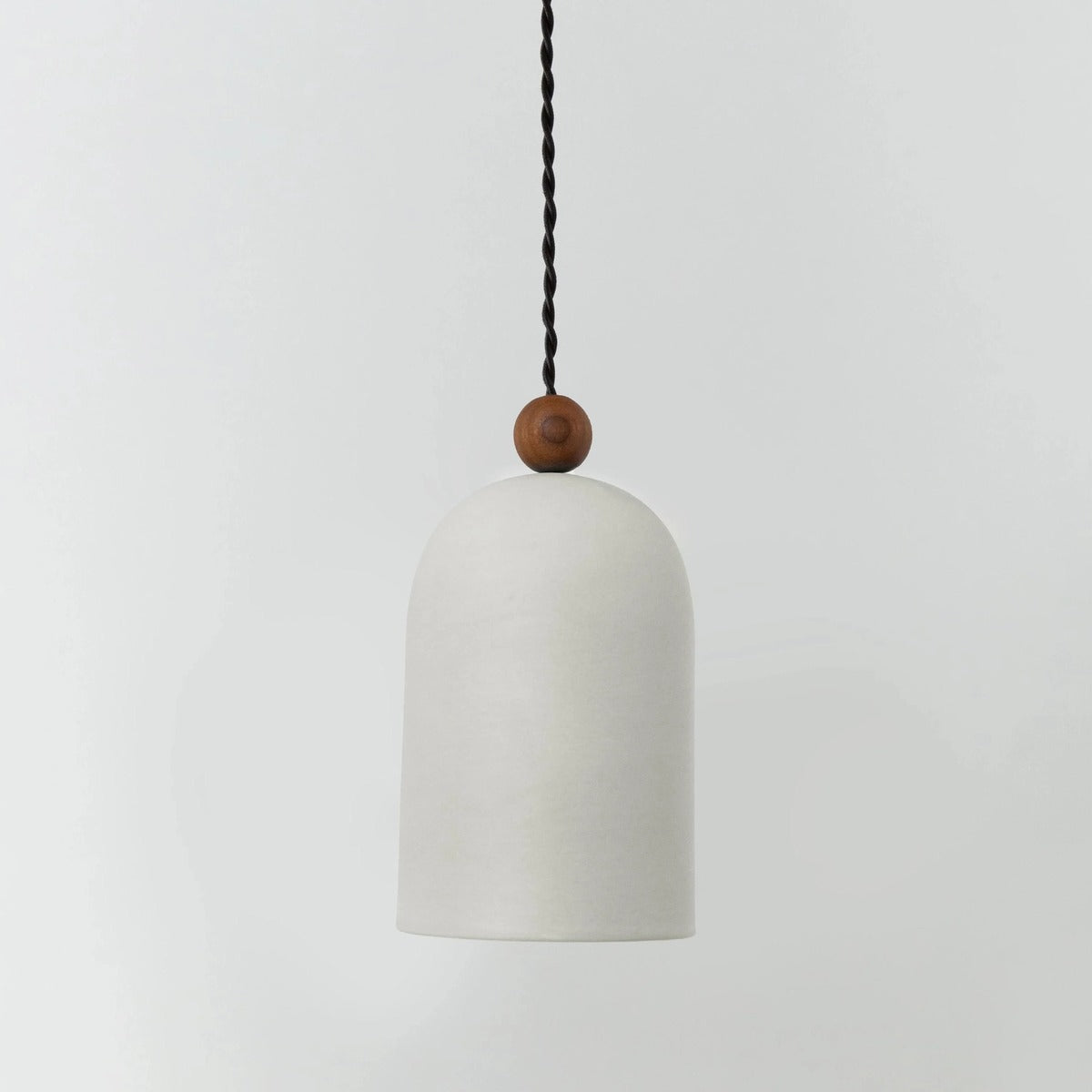 Belroven Pendant — Ivory Dome, Walnut Bead Pull, Black Cord
