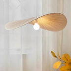 Galivora pleated wave pendant light in Cream finish against sheer curtains