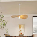 Galivora pleated wave pendant light in Ephedra tan finish above a dining table