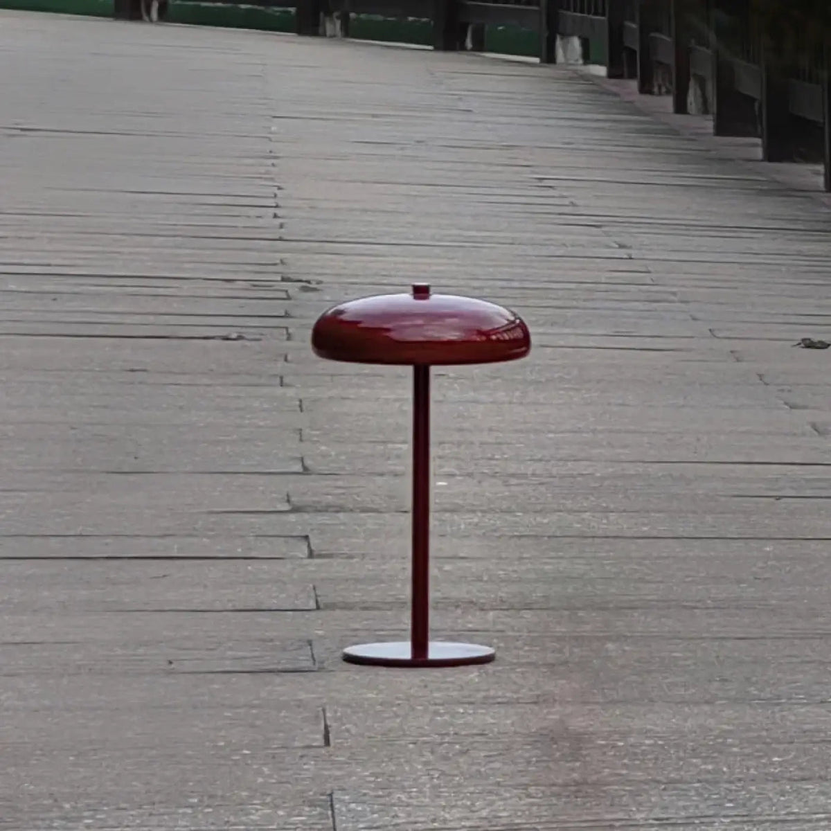 Cmoona minimalist disc metal table lamp – Crimson Red on wooden outdoor surface