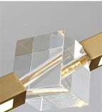 Close-up of Prevoria's faceted crystal centerpiece in brushed gold