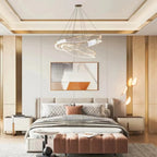 Calesto three-ring chandelier above a bedroom bed
