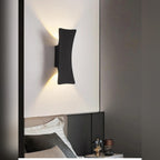 Galleron Hourglass wall sconce in black, lifestyle bedroom setting