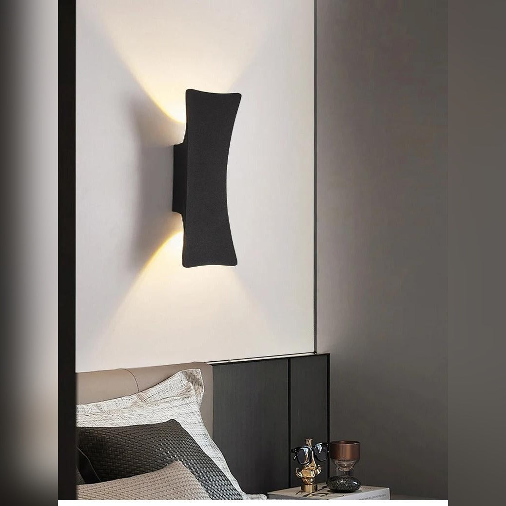 Galleron Hourglass wall sconce in black, lifestyle bedroom setting