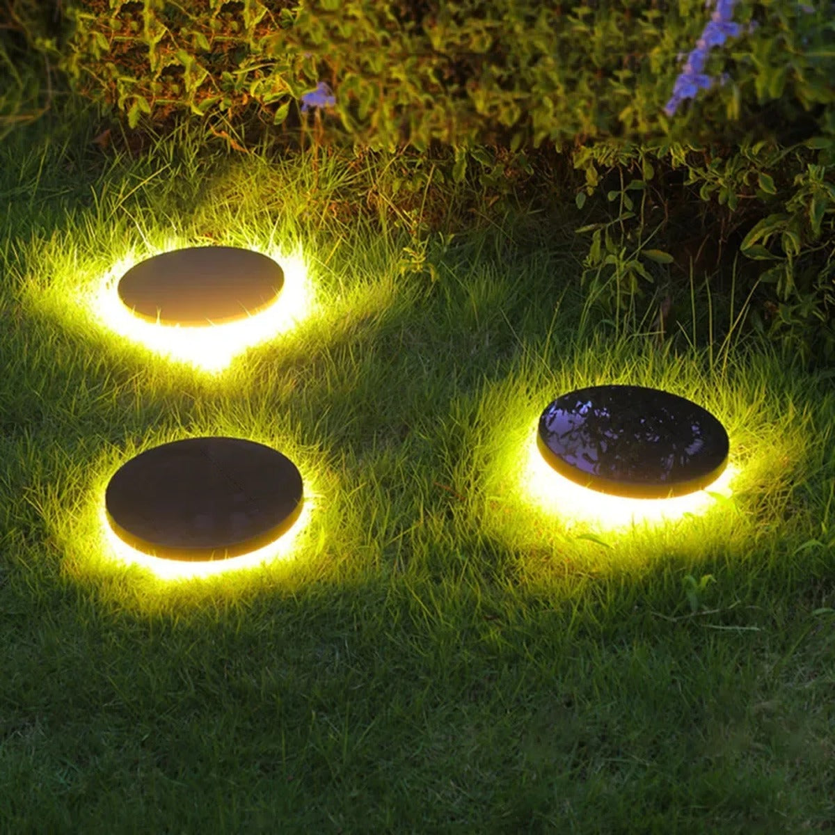 Gathrix bronze dome ground light beside a pool and patio