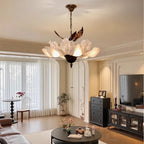 Florevian petal chandelier over a living room seating area
