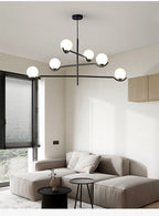 Jorval sculptural glass globe chandelier, 6-head, in a modern living room