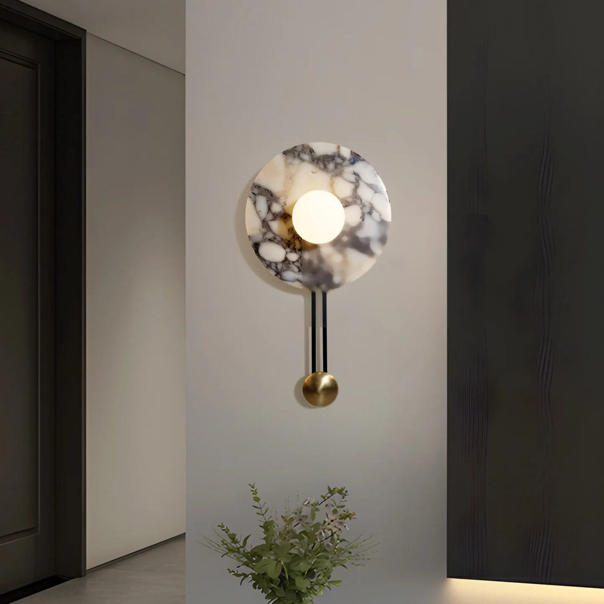 Dignaron grey-veined marble disc wall sconce with backlit natural stone mounted flush to wall