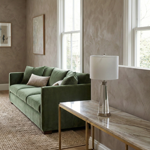 Orindel crystal column table lamp styled on a marble console beside a green velvet sofa