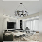 Kelrix chandelier in Smoke Grey glass above a TV living room