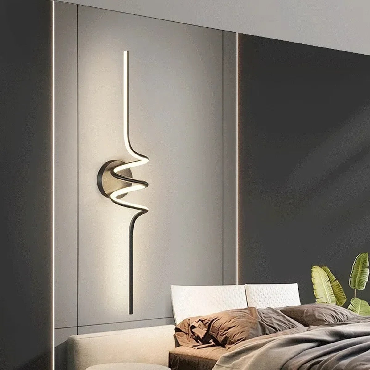 Vireth sculptural ribbon LED wall sconce — bedside lifestyle view