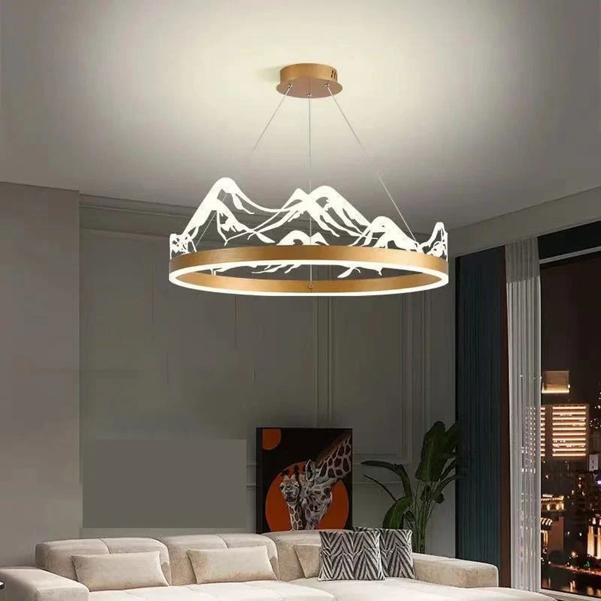 Kaldreth backlit mountain-silhouette ring chandelier — lifestyle view over sofa