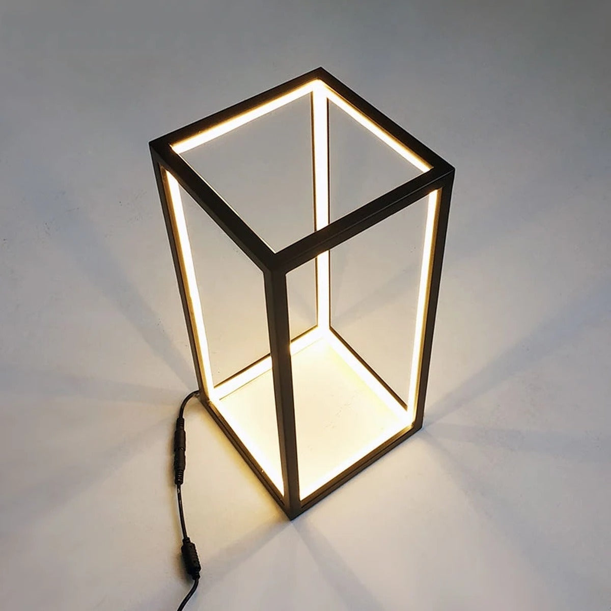 Close-up of the Welion frame — matte black metal edges with embedded LED light channels