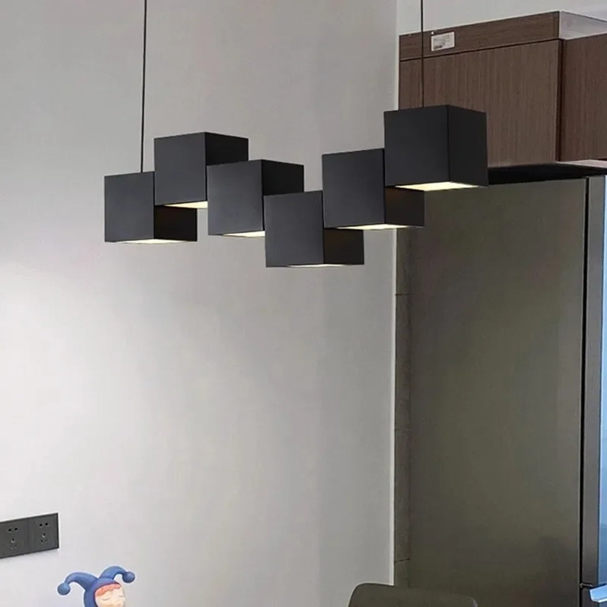 Evrixon cube pendants — all-black 6-head arrangement in industrial interior