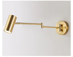 Arqventa brushed gold swing-arm wall sconce, studio shot
