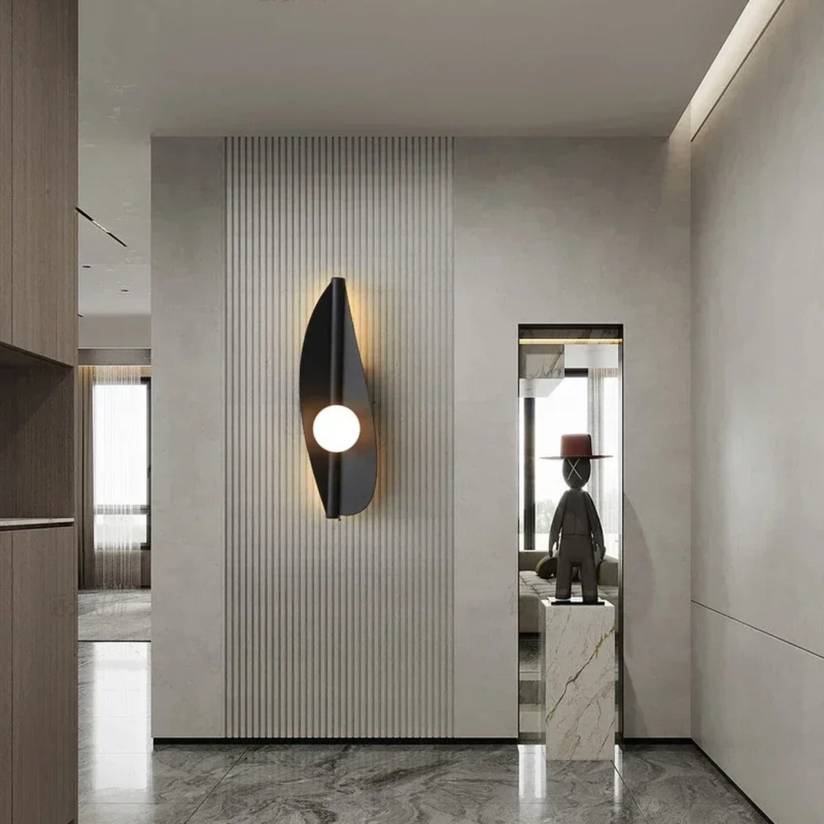 Wabi-Sabi Leaf-Form Wall Sconce Velanthos — black finish in entryway setting