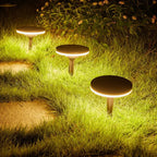 Gathrix ground lights glowing along a night garden path