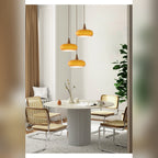 Uuaelvix wood and glass pebble pendant light, Orange three-shade round canopy over round dining table