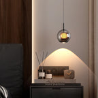 Glass Globe & Inner Mesh Pendant Light – Evrix – Bedside Lifestyle, Smoky Grey Glass