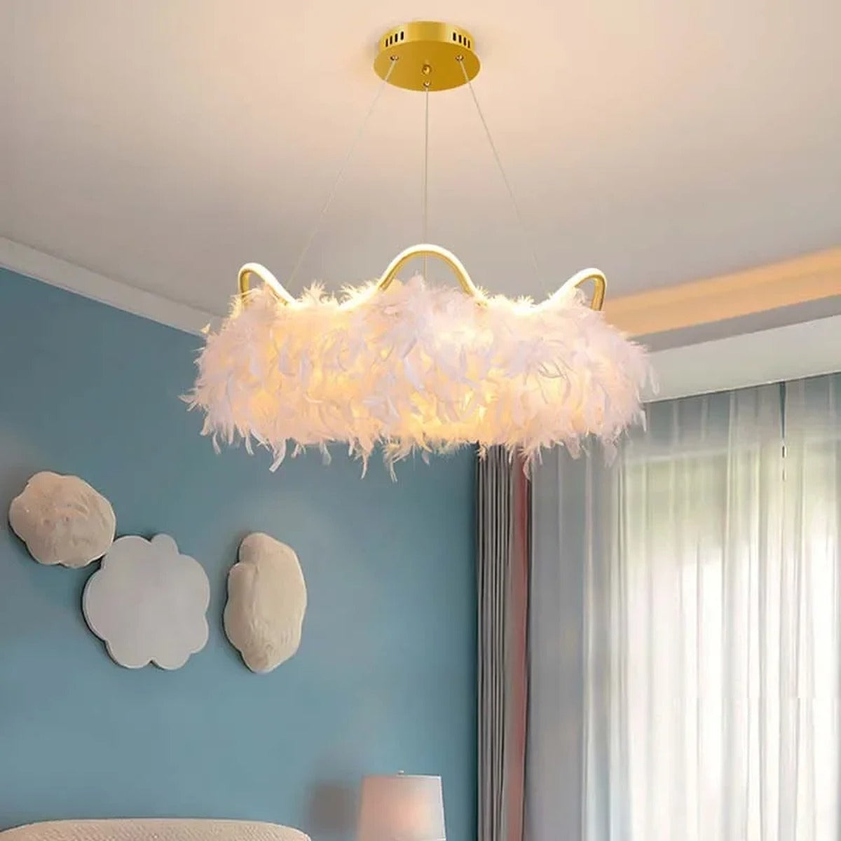 Jevon white feather halo chandelier — kids room lifestyle view above bed, blue accent wall
