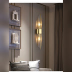 Aurelix crystal rod wall sconce in polished gold, living room lifestyle