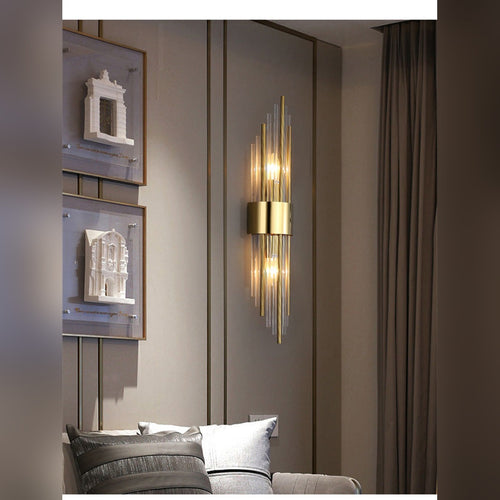Aurelix crystal rod wall sconce in polished gold, living room lifestyle