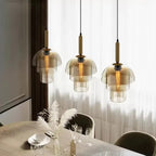 Tiered Cognac Glass Dome Pendant Light – Quarlix – lifestyle over dining table