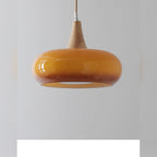 Uuaelvix wood and glass pebble pendant light, close-up of glossy glass shade in Orange