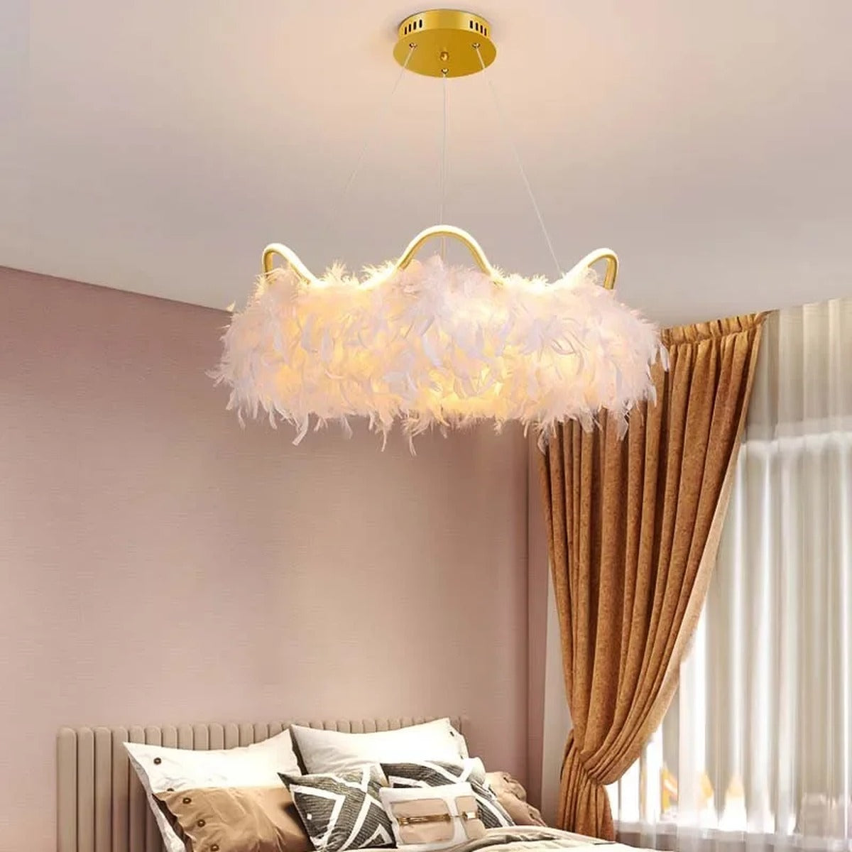 Jevon white feather halo chandelier — bedside lifestyle view, warm glow over bed with blush and rust tones