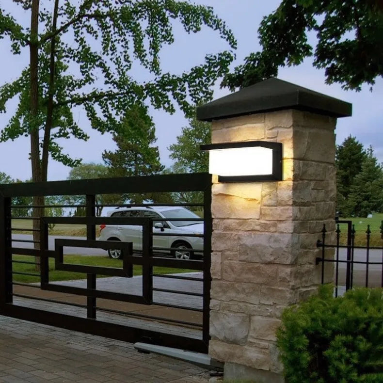 Contemporary Sculptural Outdoor Wall Light – Barienth, mounted on a stone entrance pillar