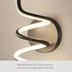 Vireth sculptural ribbon LED wall sconce — living room flanking TV