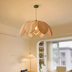 Florina woven petal dome pendant — lifestyle living room scene