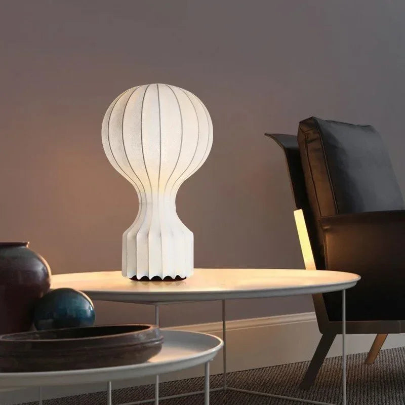 Shirokaze Large table lamp glowing on a coffee table in a moody evening living room
