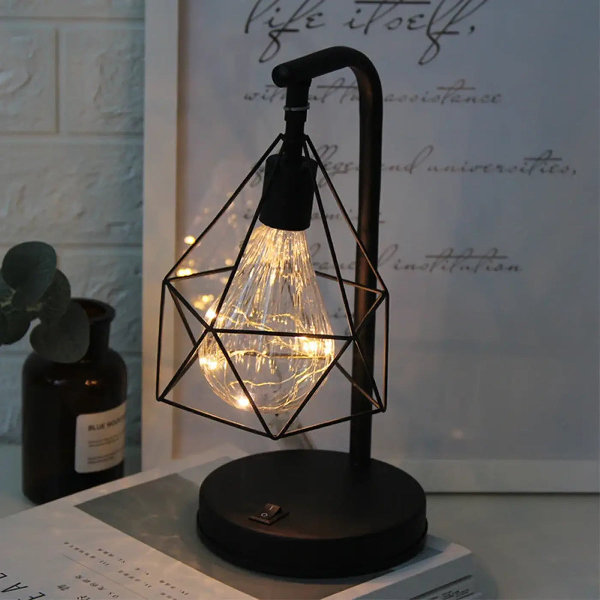 Kaelvex lamp – matte black arch and geometric cage detail