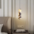 Spiral-Cut Marble Cylinder Pendant Light Lorixan – Lifestyle Bedside View