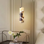 Spiral-Cut Marble Cylinder Pendant Light Lorixan – Lifestyle View with Florals