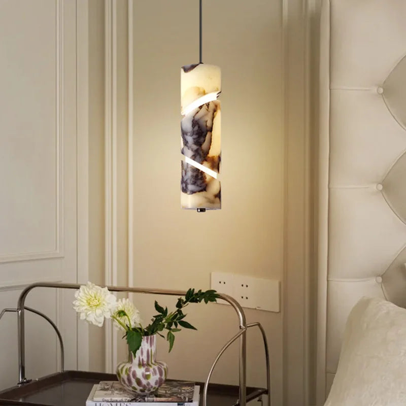 Spiral-Cut Marble Cylinder Pendant Light Lorixan – Lifestyle View with Florals