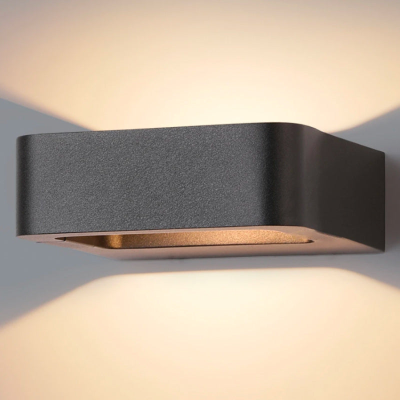 Industrial Black Metal Outdoor Wall Light Karvenis – detail angle, warm LED wash